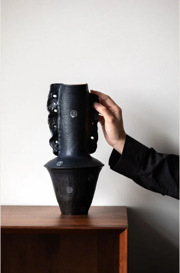 Artist-Made Hand-Pinched Black Stone Sculptural Vase in black — in a room setting