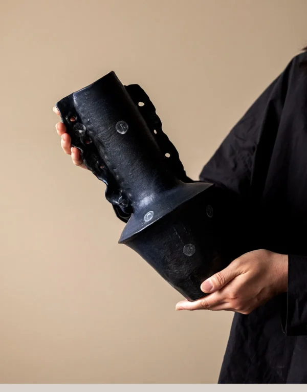 Artist-Made Hand-Pinched Black Stone Sculptural Vase in black — in a room setting