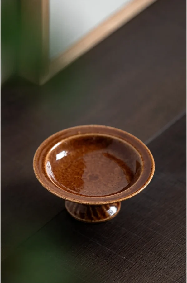 Artist-Made Footed Ceramic Dish in Glossy Brown Glaze — in a room setting