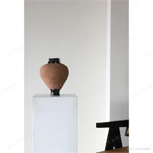Artist-Made Black Amphora Vases in black — in a room setting