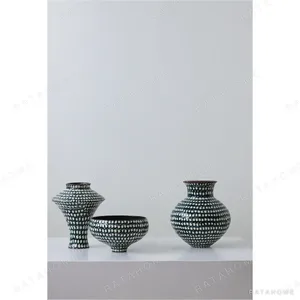 Artist-Made Teal Grid Vases with Red Rim, Five Forms in olive — in a room setting