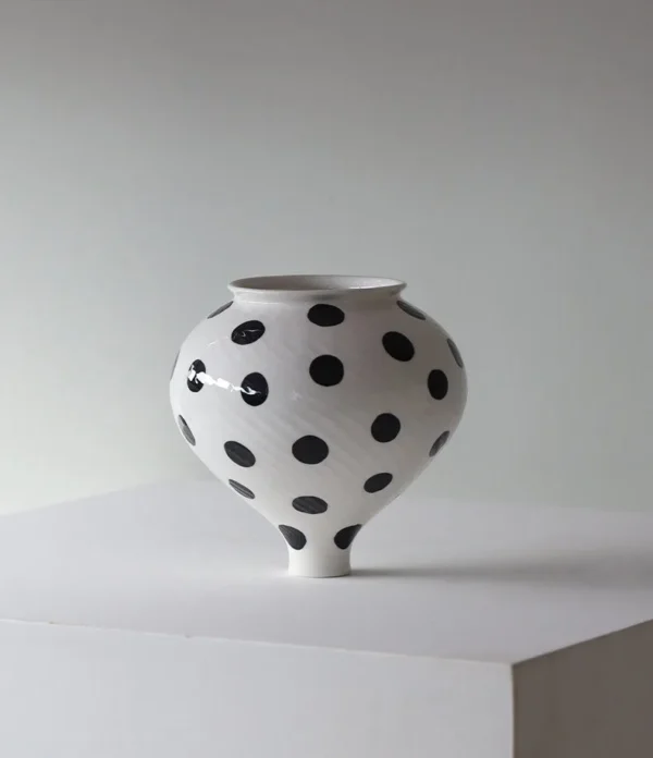 Designer Jingdezhen Polka Dot Spinning-Top Vase, Three Sizes in ivory — in a room setting