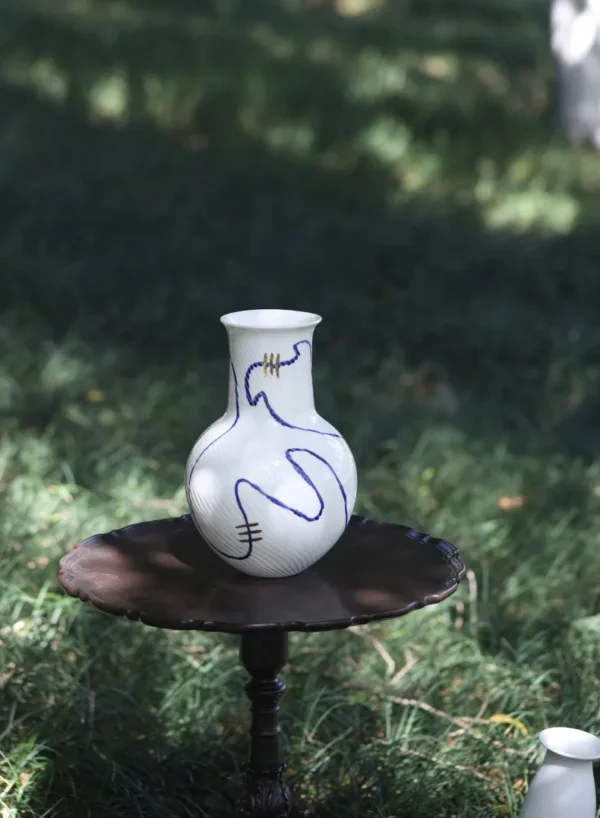 Designer Jingdezhen Blue Flower Ribbed Gourd Vase in ivory — in a room setting