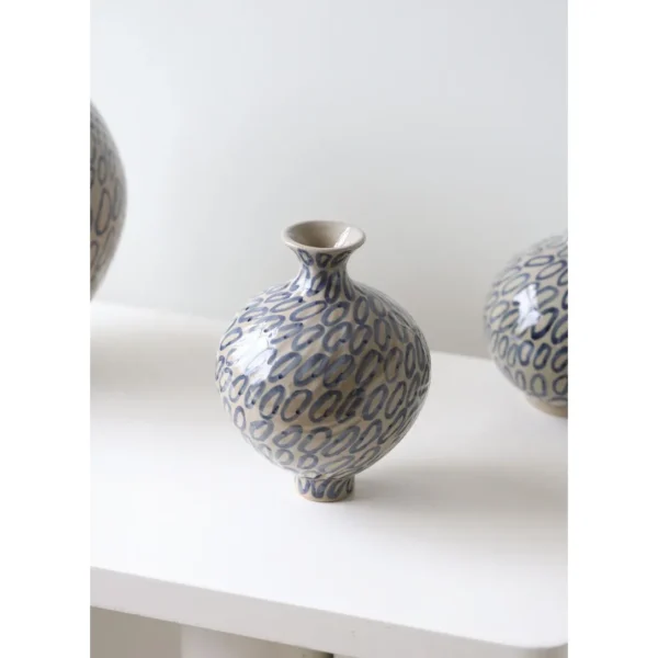 Designer Jingdezhen Ring-Pattern Ceramic Jar Vase, Large in sand — in a room setting