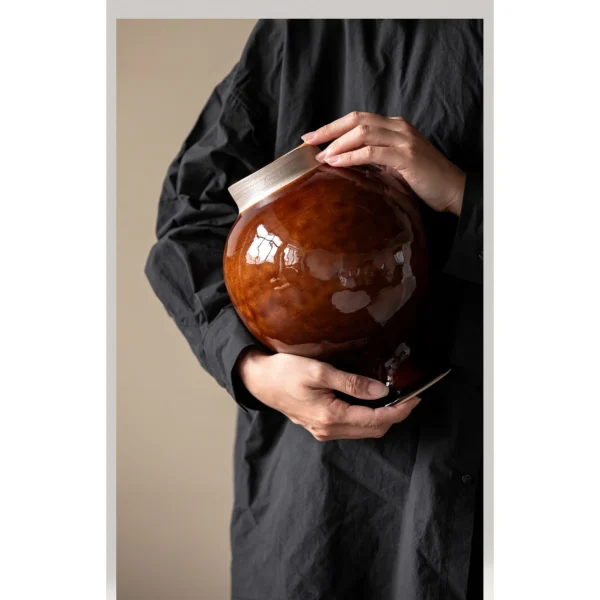 Artist-Made Kiln-Change Brown Glaze Round Stoneware Jar in clay — in a room setting