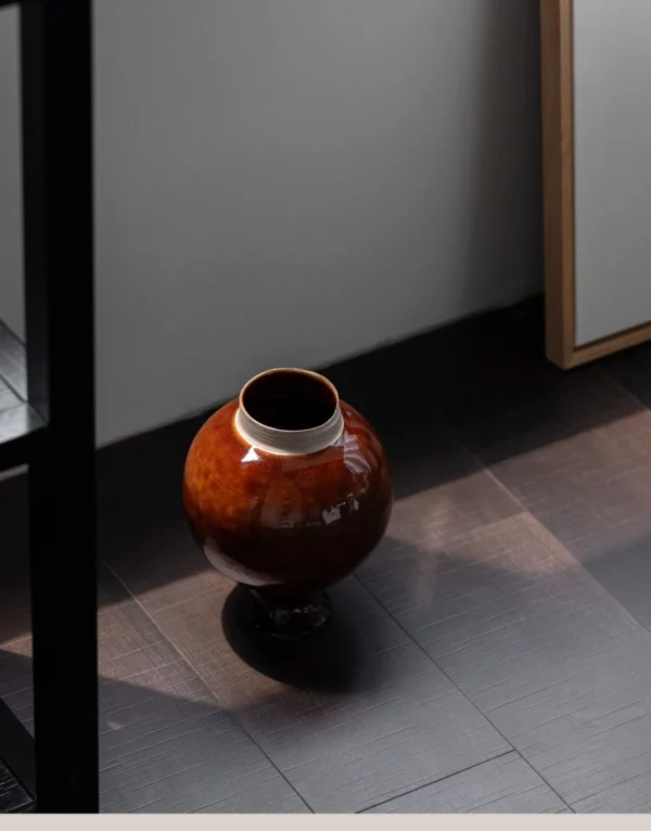 Artist-Made Kiln-Change Brown Glaze Round Stoneware Jar in clay — in a room setting
