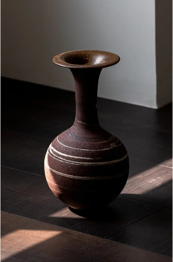 Artist-Made Marbled Stoneware Long-Neck Vase in burgundy — in a room setting