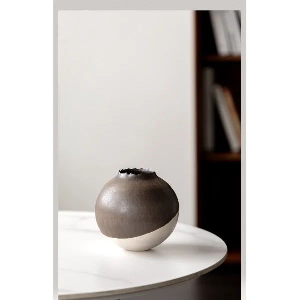Artist-Made Round Vase with Silver Torn Rim and Bronze Body in clay — in a room setting