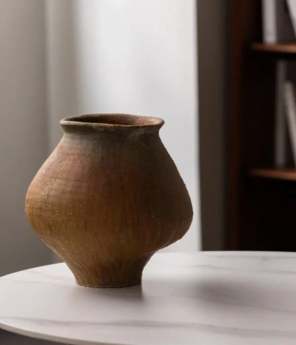Artist-Made Ribbed Rust-Ochre Wide-Shoulder Jar in clay — in a room setting