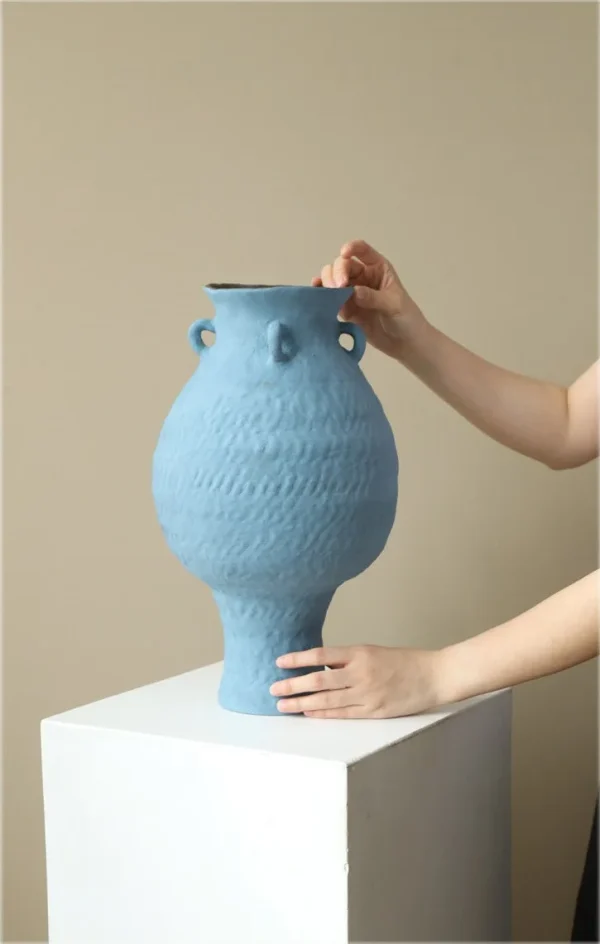 Artist-Made Matte Blue Footed Urn Vase with Ear Lugs, Medium in blue — in a room setting