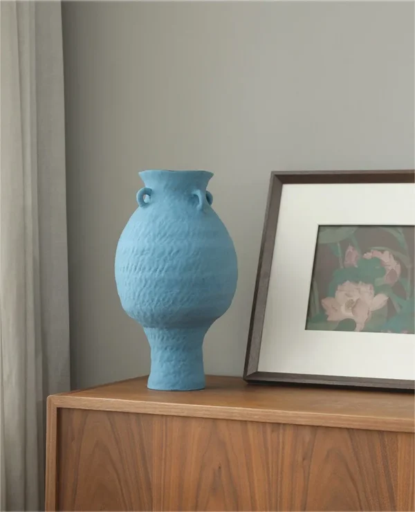 Artist-Made Matte Blue Footed Urn Vase with Ear Lugs, Medium in blue — in a room setting
