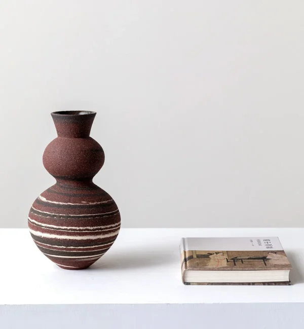 Artist-Made Marbled Clay Gourd Vase with Tree-Ring Pattern in burgundy — in a room setting