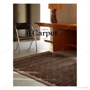 Dark Brown Grid Rug with Cream Cross Dots in clay — in a room setting