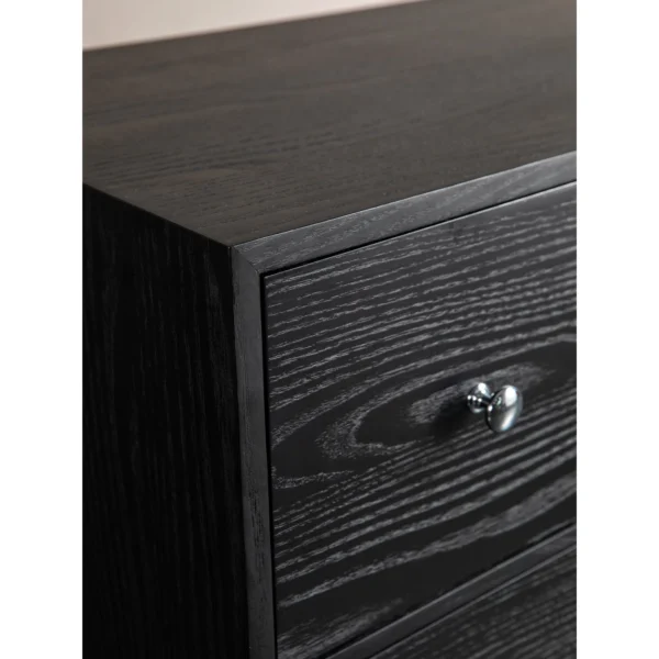 Black Wood-Grain Four-Drawer Chest with Silver Knobs in black — in a room setting