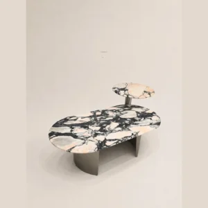Pink and Black Veined Stone Coffee Table Set on Bronze Bases in rose stone — in a room setting