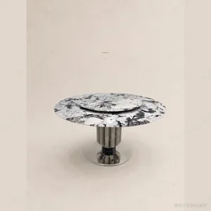Snow Mountain Blue Marble Round Dining Table in ivory — in a room setting