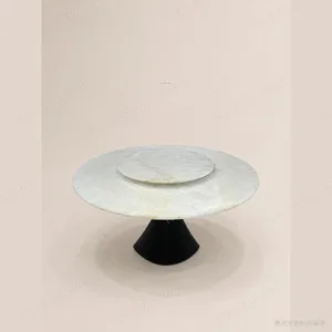 White Crystal Stone Round Dining Table on Black Cone Base in ivory — in a room setting