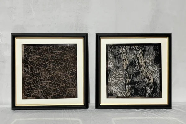 Textured Bedhead Wall Art Set of 2 in Black and Bronze — in a room setting
