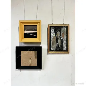 Gallery Wall Art Set of 3 in Yellow, Black and Gold Frames — in a room setting