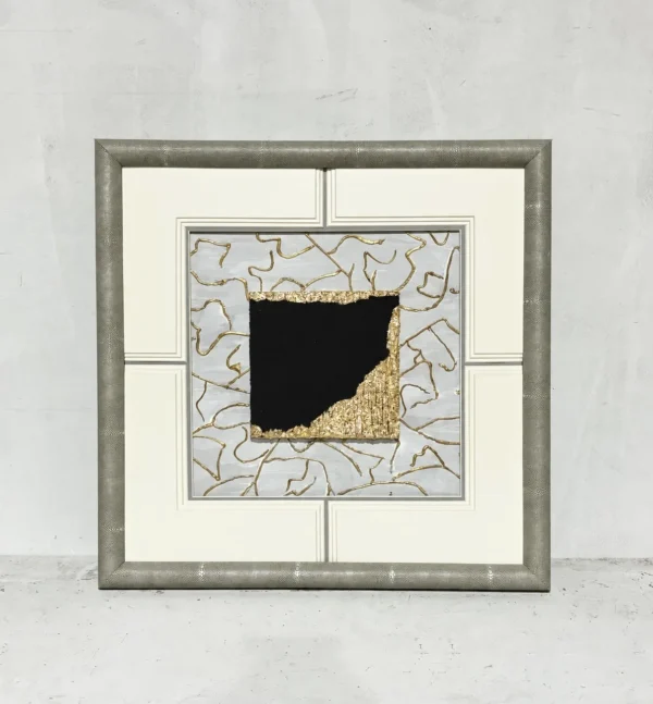 Black and Gold Marble Fragment Wall Art in Cream Frame — in a room setting