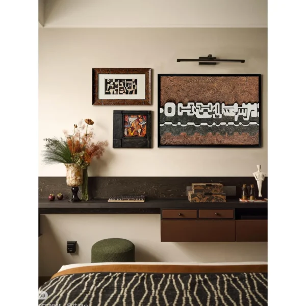 Rust Textured Wall Art Set of 3 with Picture Light in rust — in a room setting