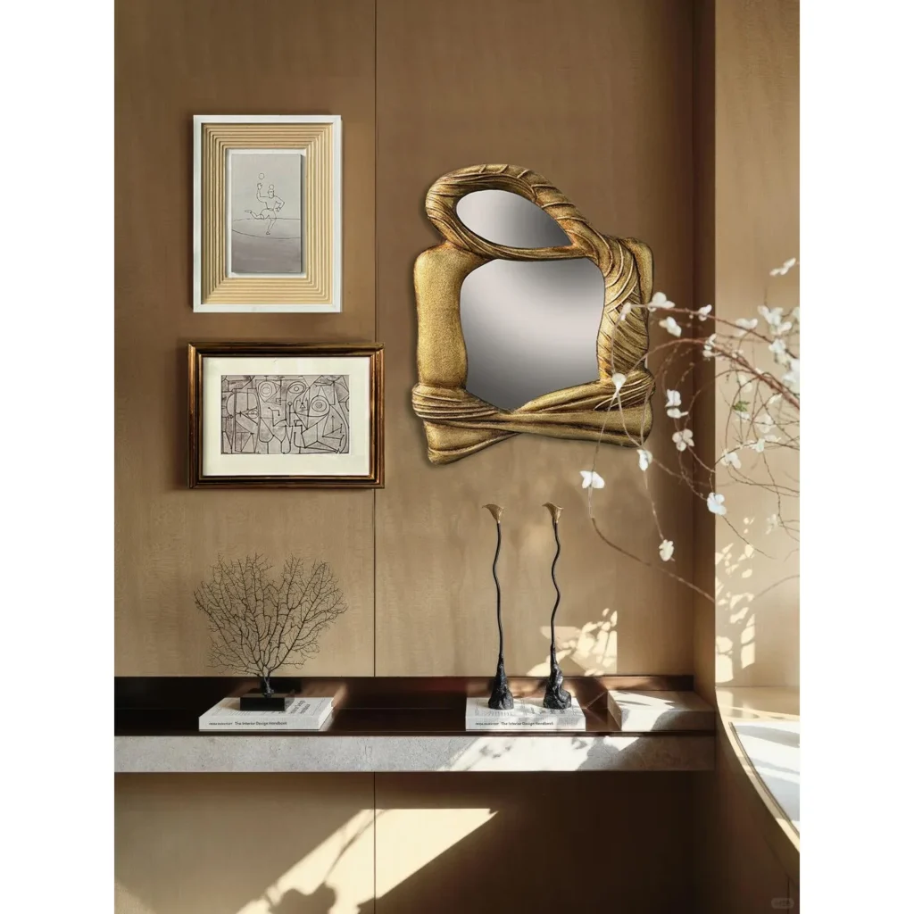 Sculptural Gold Mirror Wall Art Set with Framed Sketches in brushed brass — in a room setting