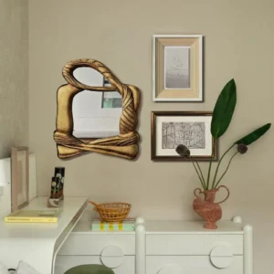 Sculptural Gold Mirror Wall Art Set with Framed Sketches in brushed brass — in a room setting