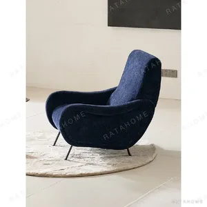 Deep Blue Chenille Curved Armchair on Black Metal Legs in blue — in a room setting