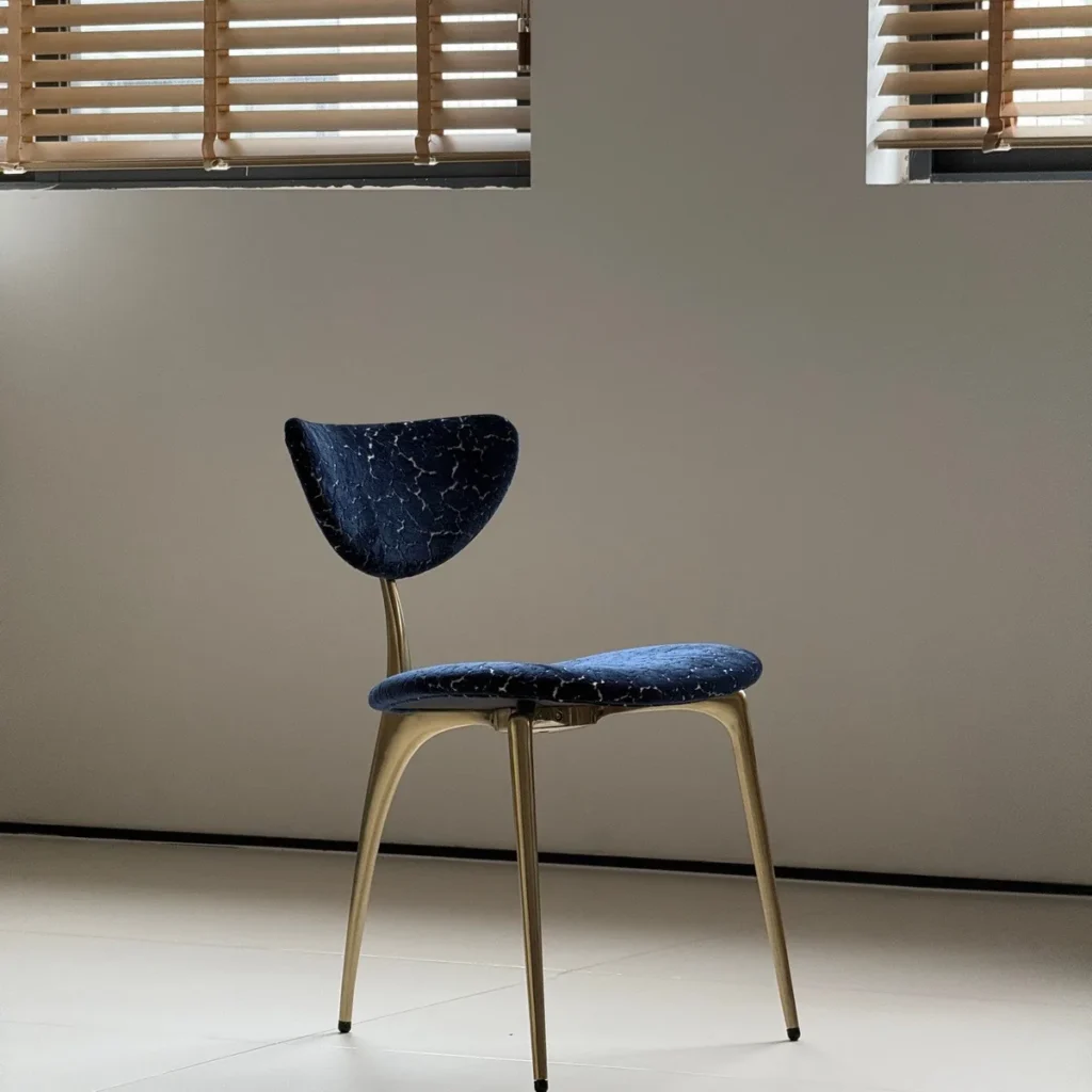 Deep Blue Velvet Petal-Back Chair on Brass Tripod Legs in blue — front view