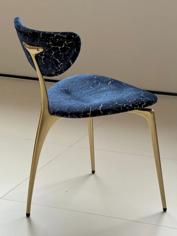 Deep Blue Velvet Petal-Back Chair on Brass Tripod Legs in blue — in a room setting