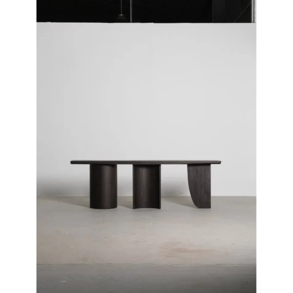 Three-Curve Ash Console Table in walnut — in a room setting