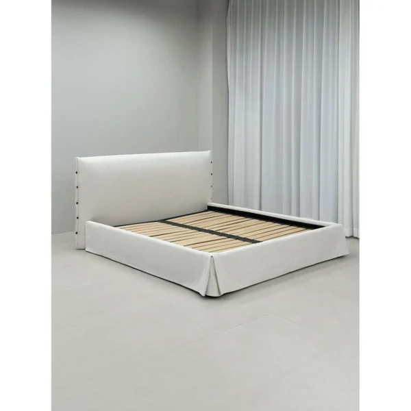 Slipcovered Fabric Bed with Buttoned Headboard in ivory — in a room setting