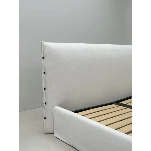 Slipcovered Fabric Bed with Buttoned Headboard in ivory — in a room setting
