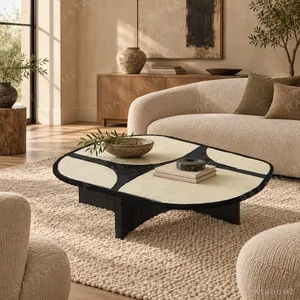 Pebble Inlay Oval Coffee Table on Black Legs in oatmeal — in a room setting