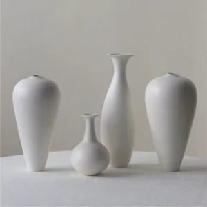 Designer Hand-Made Matte White Bud Vases, Five Forms in ivory — front view