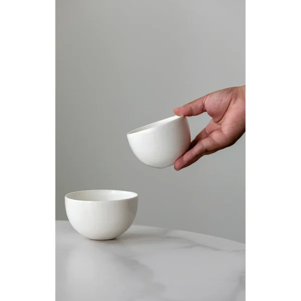 Designer Hand-Made Plain White Ceramic Rice Bowl in ivory — in a room setting