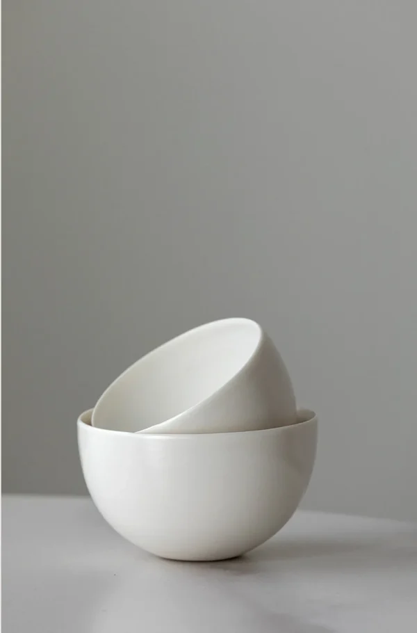 Designer Hand-Made Plain White Ceramic Rice Bowl in ivory — in a room setting