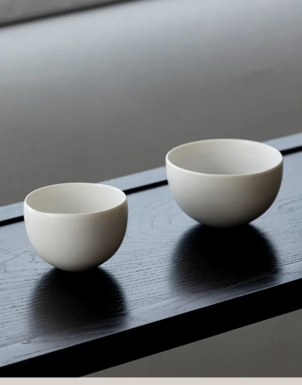 Designer Hand-Made Plain White Ceramic Rice Bowl in ivory — in a room setting