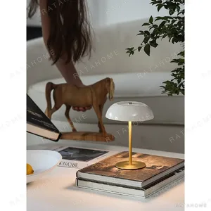 Portable Brass Mushroom Table Lamp with Touch Dimmer in ivory — in a room setting