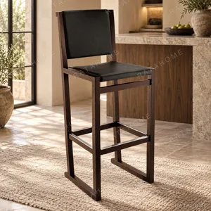 Black Leather High-Back Bar Stool on Dark Frame in black — in a room setting