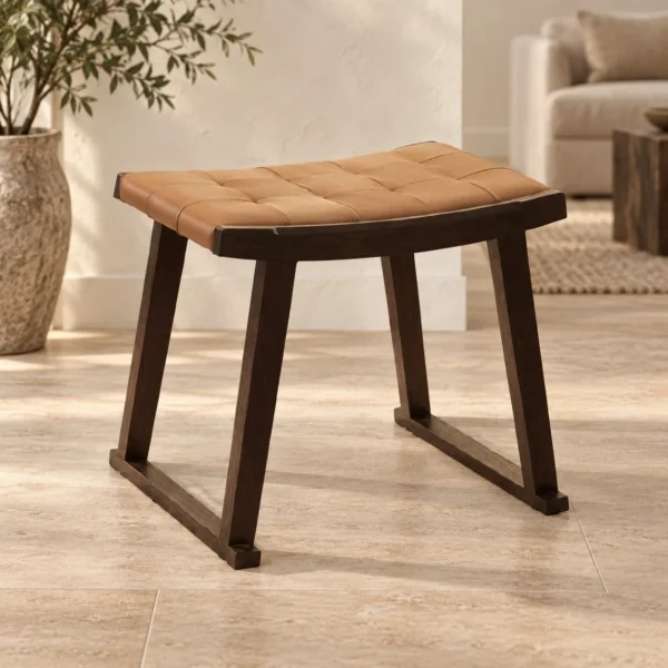 Woven Tan Leather Saddle Stool on Dark Wood Sled in clay — in a room setting