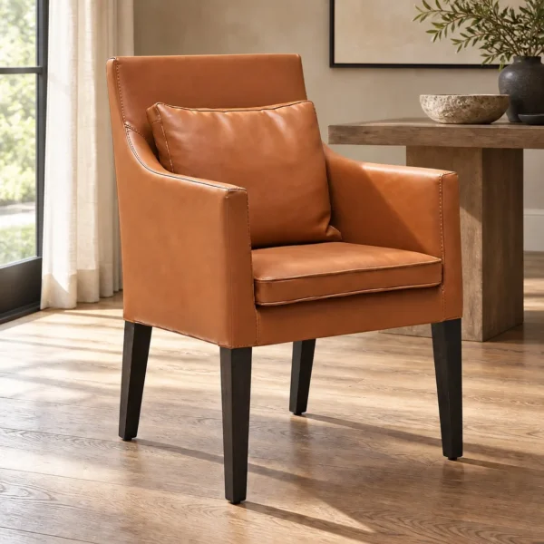 Caramel Leather Dining Armchair with Loose Cushions in clay — in a room setting