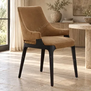 Tan Suede Wing-Back Dining Chair on Black Legs in clay — in a room setting