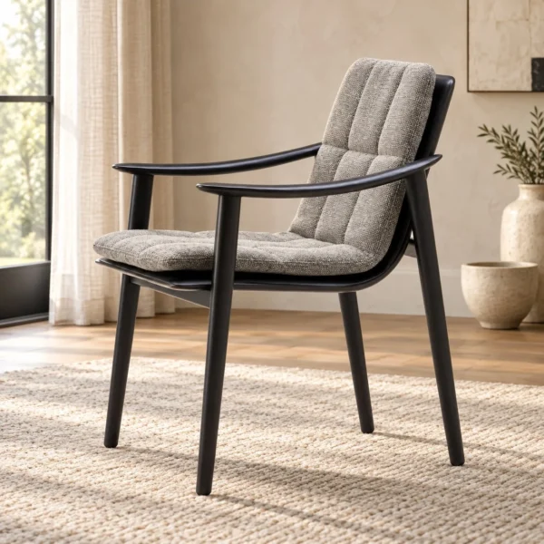 Black Wood Armchair with Grey Channel-Quilted Cushions in black — in a room setting