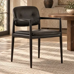 Black Wood Armchair with Black Leather Seat and Back in black — in a room setting