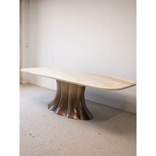 Travertine Dining Table on Bronze Flared Pedestals in oatmeal — in a room setting