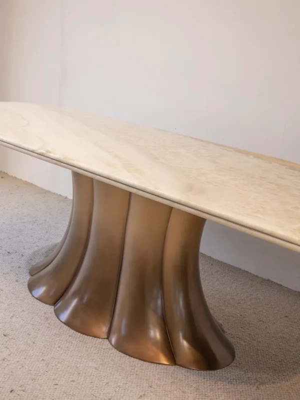 Travertine Dining Table on Bronze Flared Pedestals in oatmeal — detail