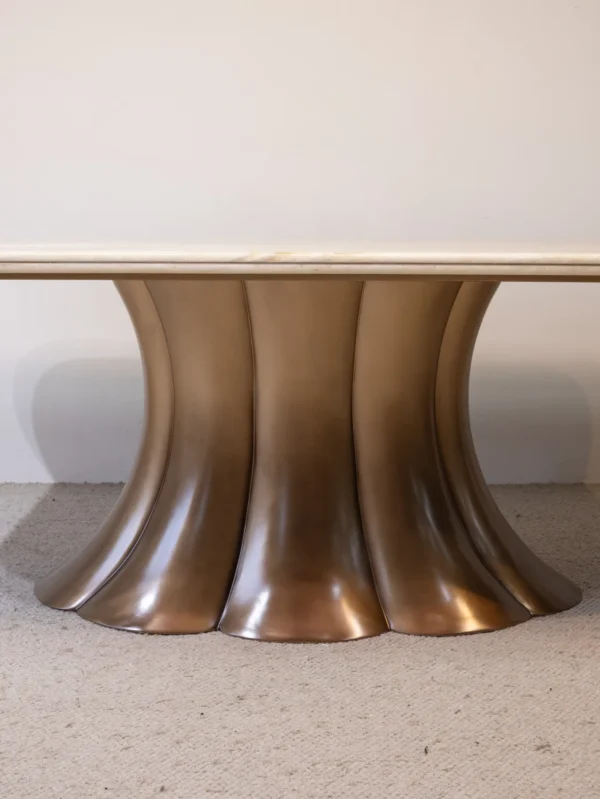 Travertine Dining Table on Bronze Flared Pedestals in oatmeal — detail