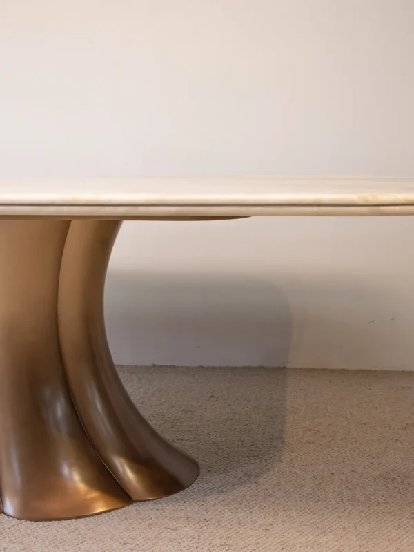 Travertine Dining Table on Bronze Flared Pedestals in oatmeal — detail