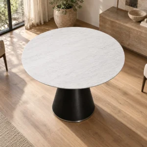 White Marble Round Table on Black Cone Pedestal in ivory — in a room setting